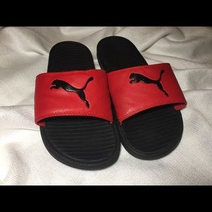 red and black puma slides